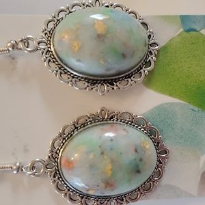 Handcrafted earrings made of flukstone and base metal By designer Gina Witten